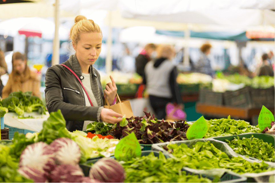 woman chooses healthy green produce