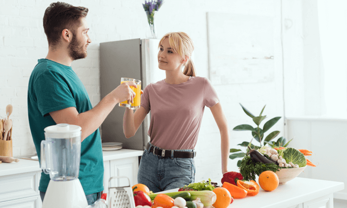 Couple drinking detox juice before Liver Cleanse or Gallbladder Flush